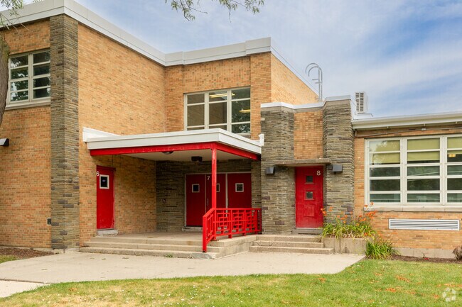 Charles H. Wacker Elementary School entrance 6, 7 and 8 red doors, Chicago, IL.