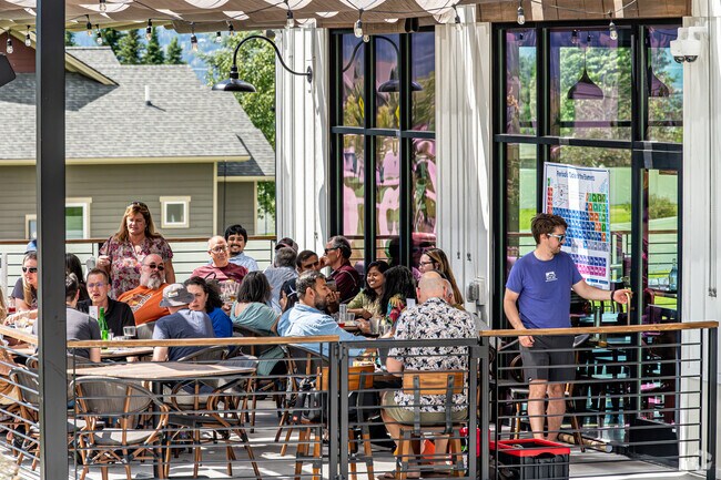 Patrons at The Den enjoy hearty meals in a warm, inviting atmosphere.