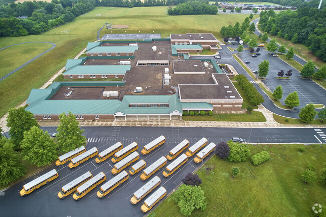 Harmony Middle School has a gathering of buses waiting for its students.