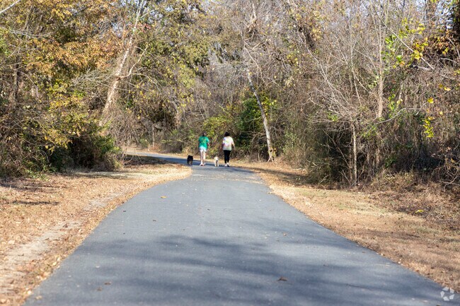 Take a leisurely stroll with your dogs Muddy Creek Greenway in Stonebridge-Rollinghills.