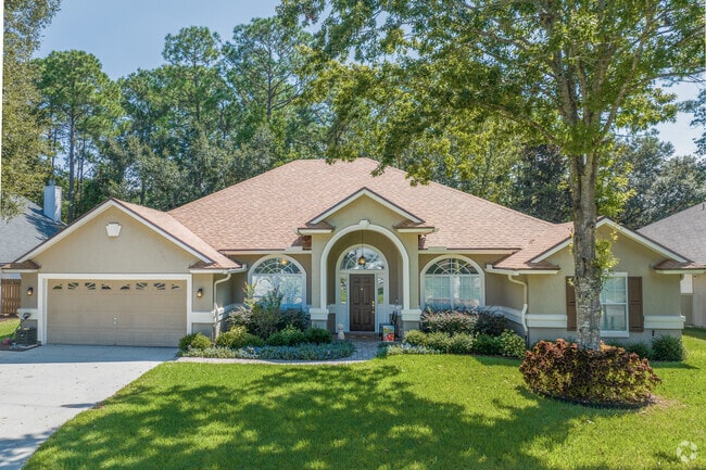 Find home in the shaded yards of Fruit Cove.