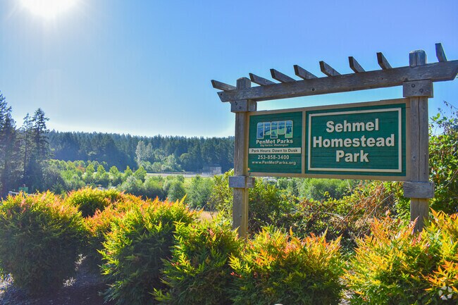 Sehmel Homestead Park welcomes visitors with a sign at its Gig Harbor entrance near Rosedale.