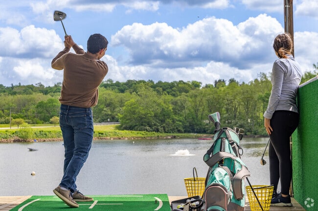 You can perfect your swing with a view at the Four Seasons Golf Range.
