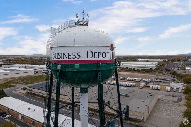 A tall water tower marks acts as a landmark for Business Depot.
