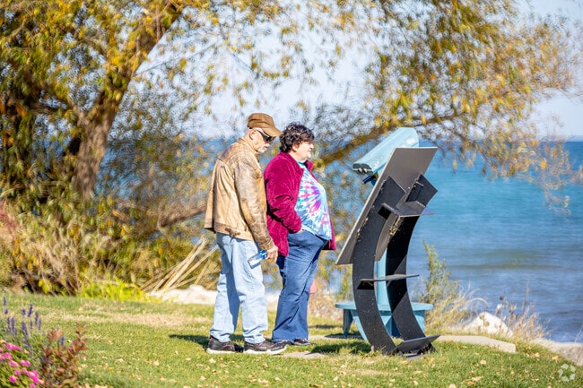 Information plaques give the local history of Lake Michigan at Wind Point north of Slausondale.