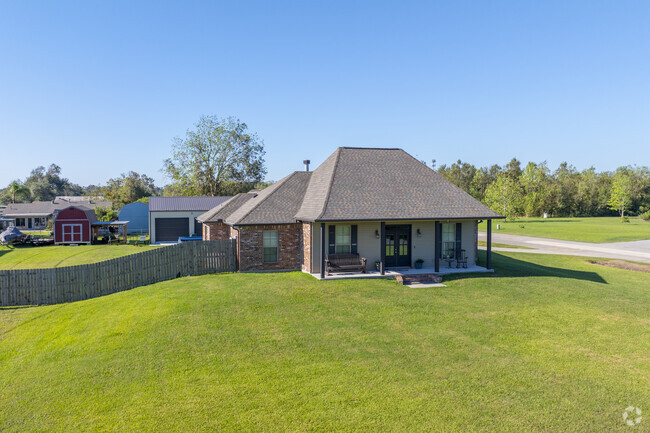 An Acadian style home with a large yard on Texas Gulf Rd in Bourg.