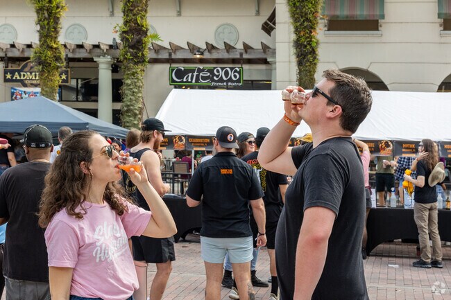 A couple enjoys the beer tasting at the Faded Kingdom Beer Fest in Baldwin Park.