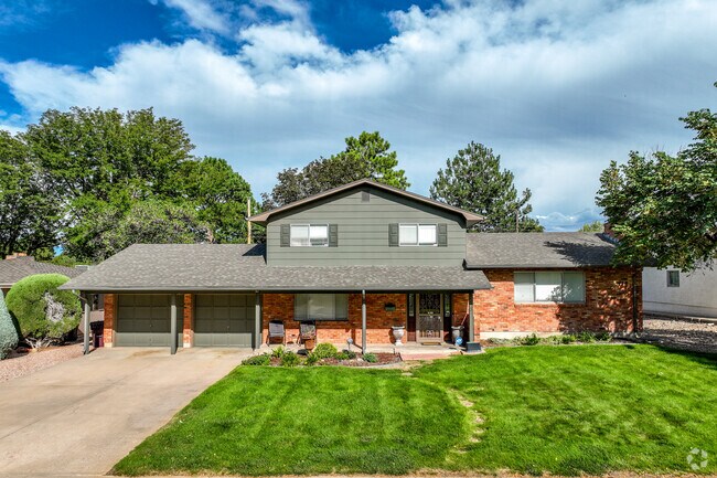 Sunset homes from the 50s and 60s have moderately sized front yards alongside paved driveways.