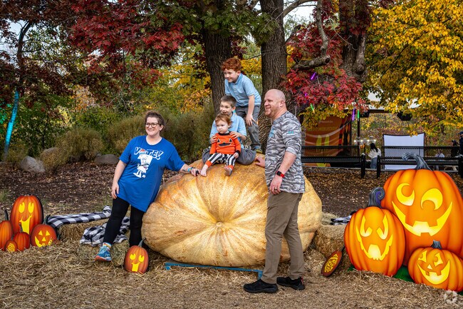 Climb on top of the giant pumpkin at the Minnesota Zoo Jack o Lantern Spectacular in Scott Highlands.