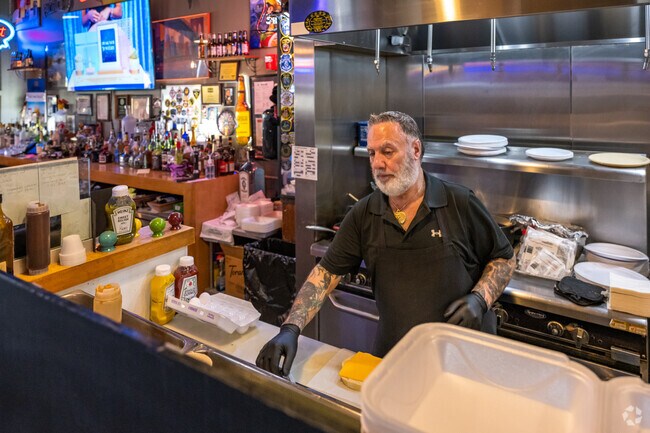 The best place to stop for breakfast or good burger is Gus' Deli, south of Johnson's Woods.