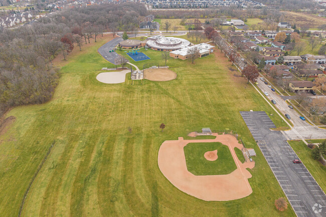Mabel O'Donnell Elementary School has an open grass area and baseball field.
