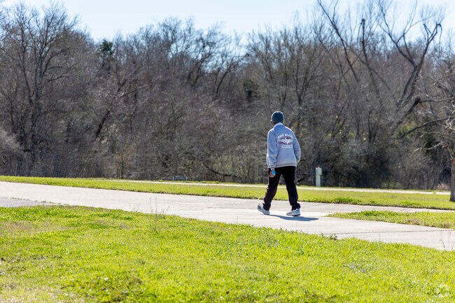 Go for a stroll around a neighborhood park in Manor, TX.