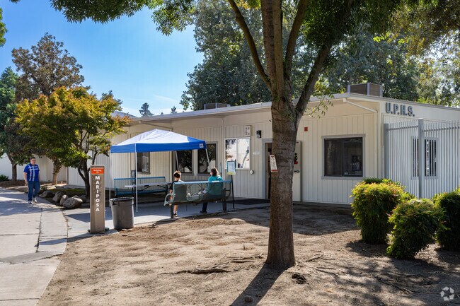 Students of University Preparatory High School prepare to enter for their morning class.