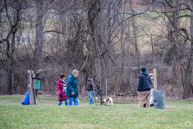 People walk their dogs along the scenic trail at South Park near Union Township.