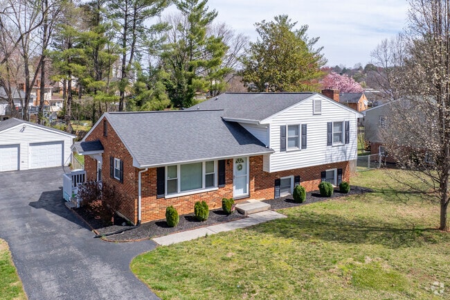 A nice split-level with a spacious yard and a two door garage.