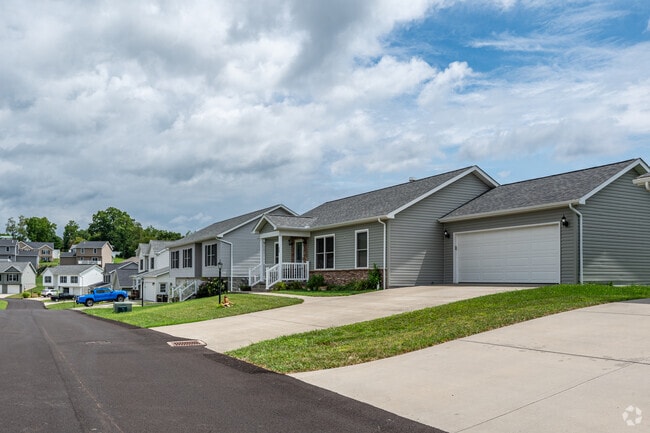 A row of newly constructed homes in Brookhaven line the street.