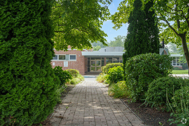 Lushly landscaped paths lead to Russell Elementary School.