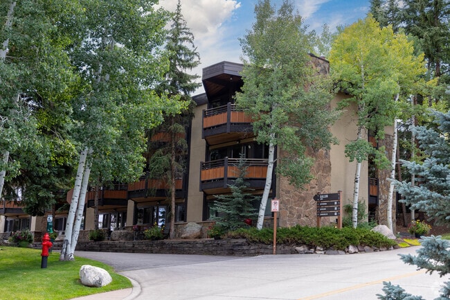 Snowmass condos sit among trees, blending privacy with proximity to amenities.