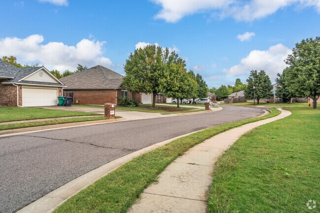 Homes along a winding road in Frolich Meadows Estates near Tinker Air Force Base.