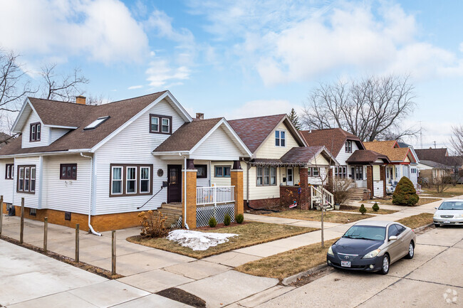 A row of perfect Tudor-style homes shine in The 13th Ward.