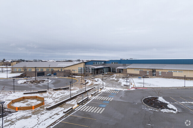 Cheney Middle School features a large parking lot for visitors and staff.