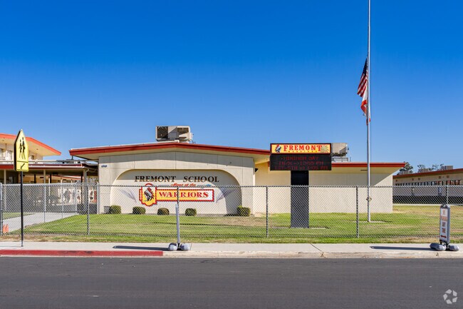 An American flag waves outside the entrance to Fremont Elementary School in Delano.
