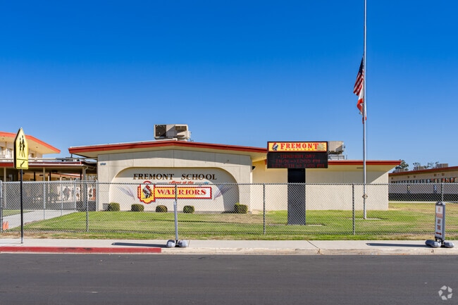 An American flag waves outside the entrance to Fremont Elementary School in Delano.