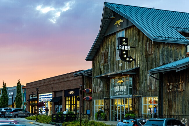 Shoppers in Stoneybrook-Brigadoon browse luxury brands at The Summit at Fritz Farm.
