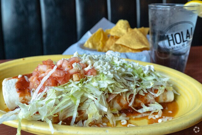 The Burrito Deluxe has one chicken and one beef burrito smothered in yummy in Eureka.