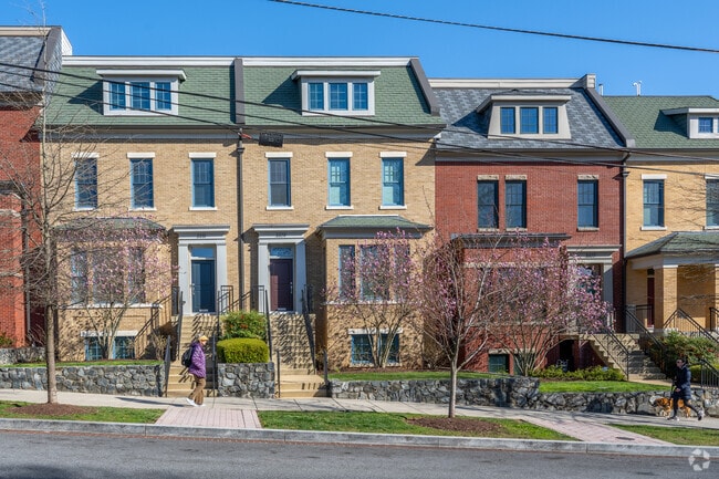 A line of brick Federalist-style row homes on Idaho Ave NW in McLean Gardens.