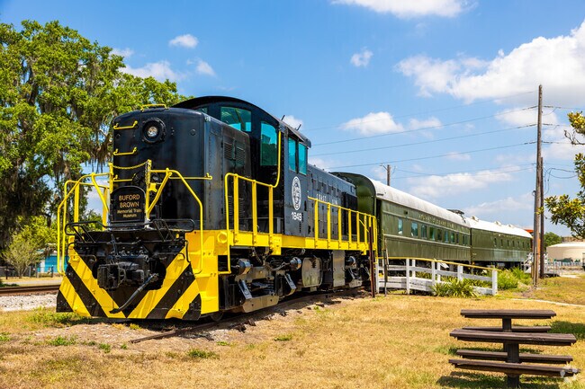 Locals can enjoy some lunch in the sunshine next to the historic train engine.