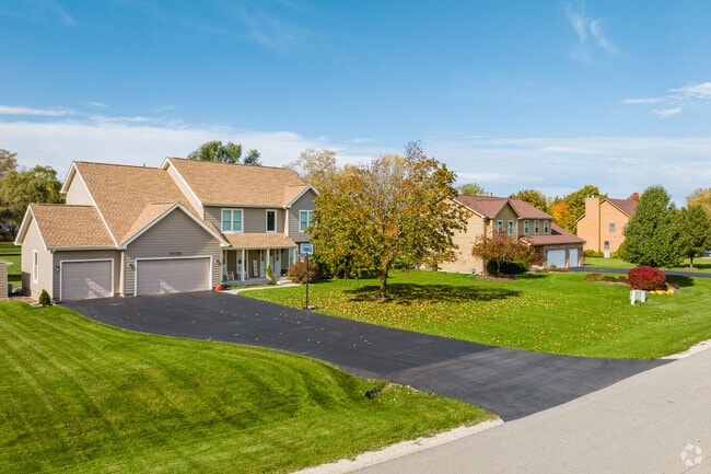 Homes in Regency have long driveways with multi-car garages.