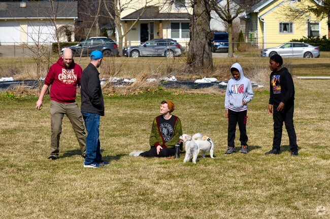 Westside neighbors enjoy time together with their dogs at Letts Park.