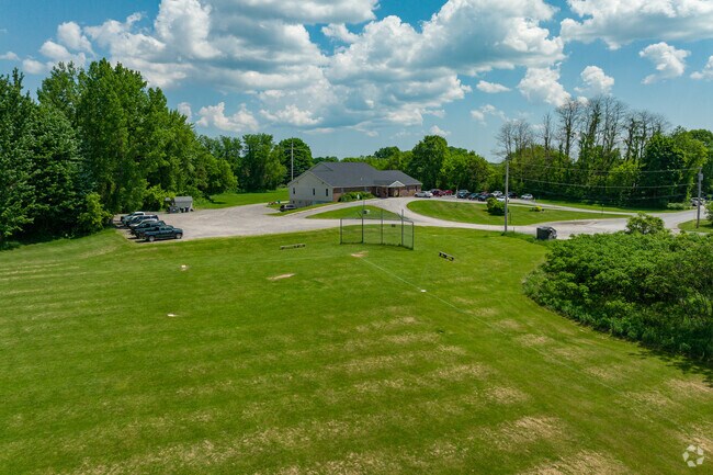 Students can play a game of baseball at Holy Cross Academy.