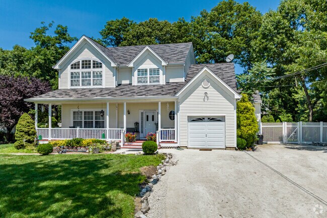Check out this cute farmhouse style home in Rocky Point.