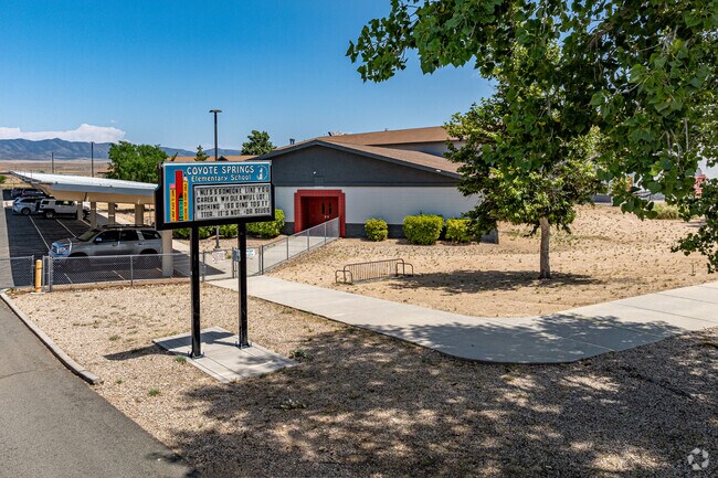 Coyote Springs Elementary School is shaded by large mature trees.