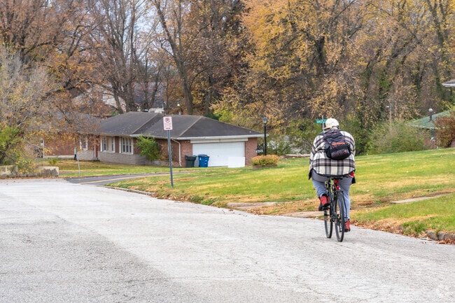 A man takes a ride down the street in the Riverview neighborhood.