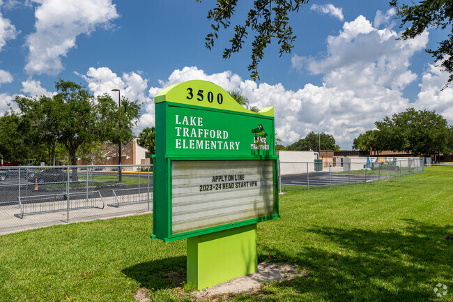 Lake Trafford Elementary School in Immokalee welcomes students with a large colorful sign.