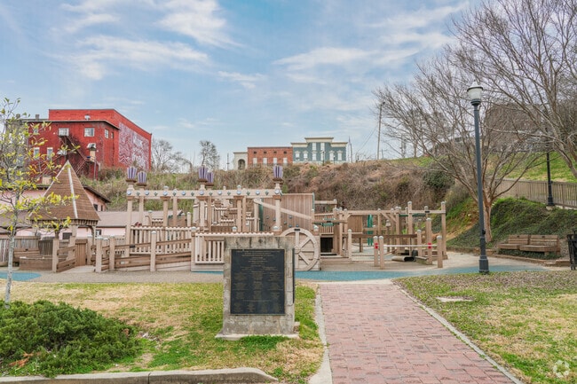 Catfish Row Children's Art Park in Vicksburg, Mississippi, offers playful areas, garden walks, a splash fountain, children's art, murals, and unique exhibits.
