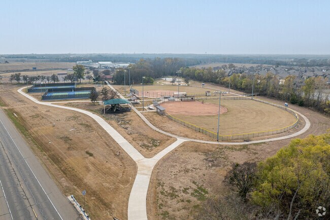 A walking track lines sports fields and tennis courts at Forrest Moore Park.
