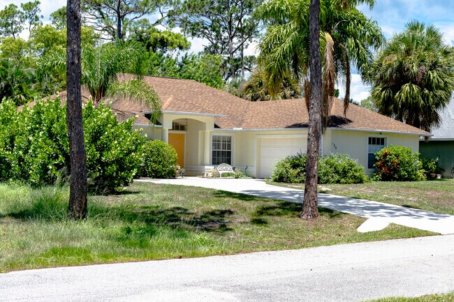 This Wabasso home is afforded privacy by a variety of mature trees.