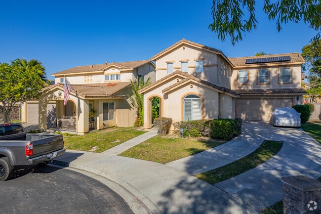 A typical residential neighborhood in Otay Ranch Village features homes with attached garages.