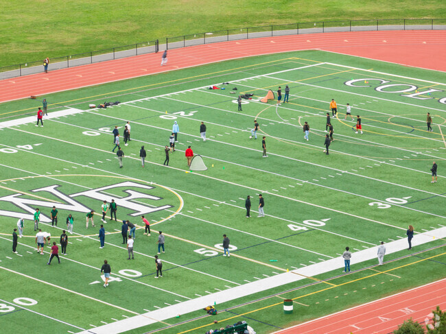 The kids enjoying the school field at Nathaniel Woodhull Elementary School.