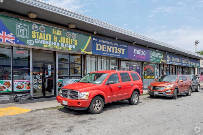 Local shops and restaurants line E 233rd Street in Edenwald neighborhood.