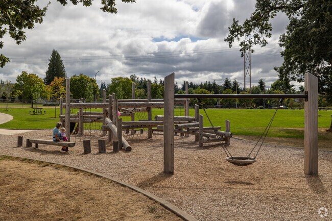 Tyrone S. Woods Park’s wooden playground offers family fun, just outside Gaffney Lane.