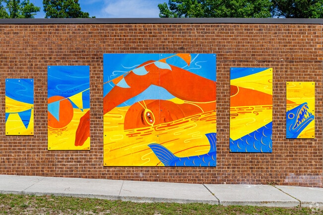 Local artists painted a mural of a swimmer at the YWCA near Woodberry Forest.