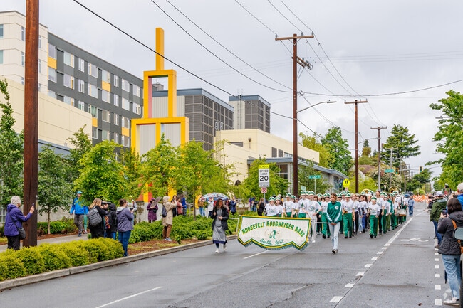 Kicking off their spring parade season, the Roosevelt HS Marching Band performs for the locals.