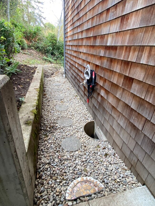 To the left of the front door