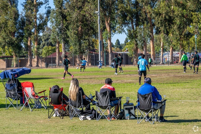 Locals enjoy a soccer match at College Park near Terrace Estates in Oxnard, California.