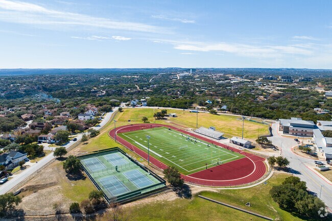 Hudson Bend Middle School football, track field, and tennis court in Apache Shores.